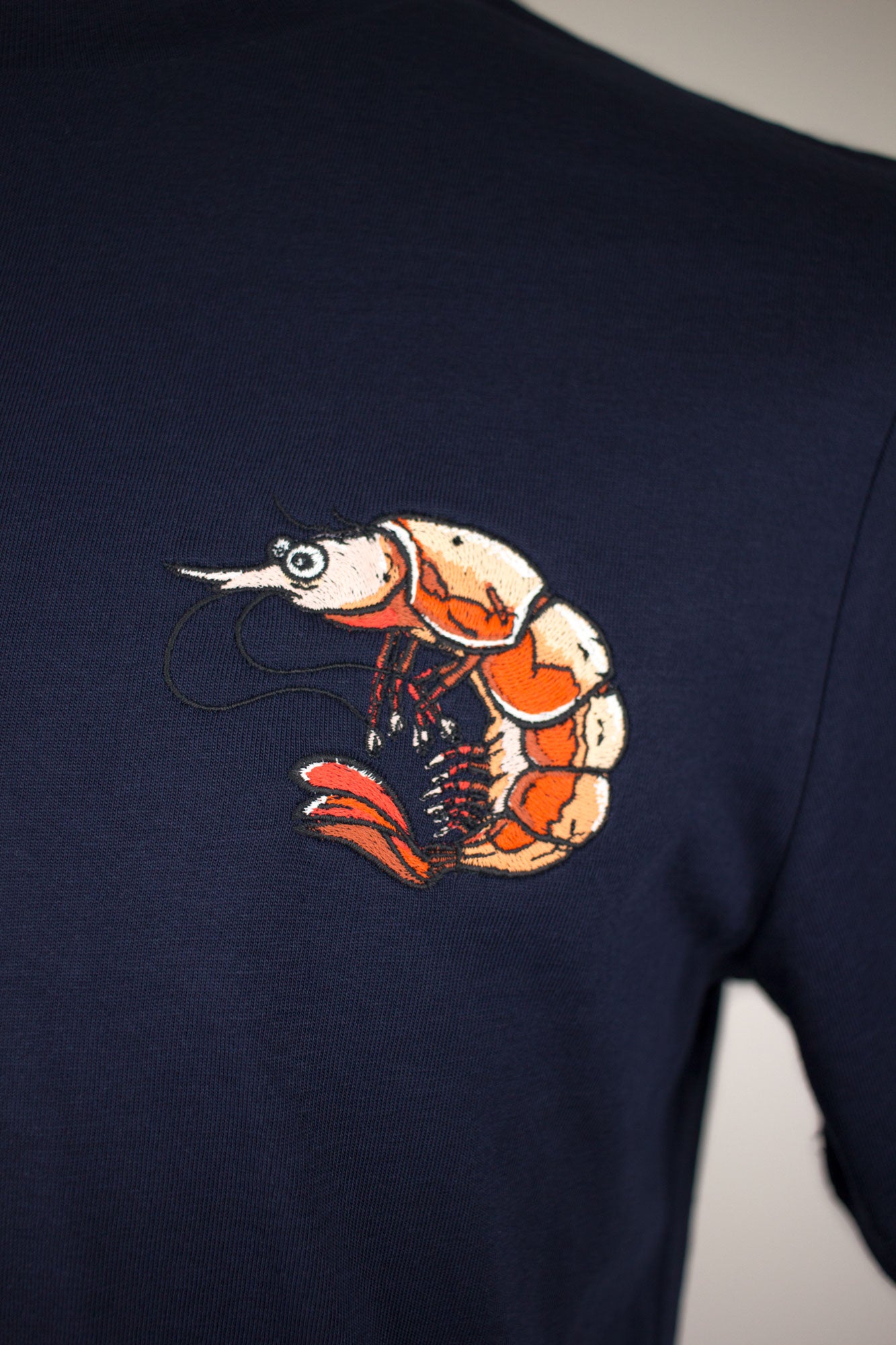 Close up of Shrimp embroidery T-Shirt by The Embroidery Crew