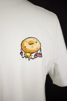 Close up of embroidered Bagel design on a white T-Shirt by The Embroidery Crew