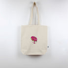 A natural coloured tote bag with donut embroidery by The Embroidery Crew