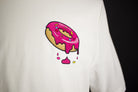 Close up of embroidered Donut design on a white T-Shirt by The Embroidery Crew