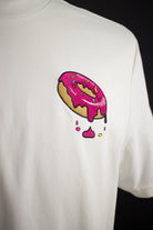 Close up of embroidered Donut design on a white T-Shirt by The Embroidery Crew