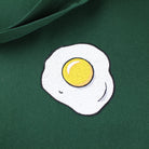 Close up of a green tote bag with Egg embroidery by The Embroidery Crew