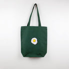 A green tote bag with Egg embroidery by The Embroidery Crew