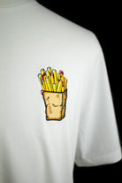 Close up of embroidered Fries design on a white T-Shirt by The Embroidery Crew