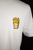 Close up of embroidered Fries design on a white T-Shirt by The Embroidery Crew