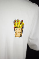 Close up of embroidered Fries design on a white T-Shirt by The Embroidery Crew