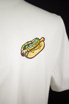 Close up of embroidered Hotdog design on a white T-Shirt by The Embroidery Crew