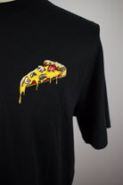 Close up of embroidered Pizza design on a black T-Shirt by The Embroidery Crew