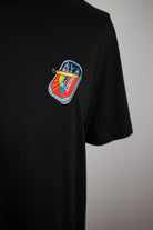 Close up of embroidered Sardines design on a black T-Shirt by The Embroidery Crew