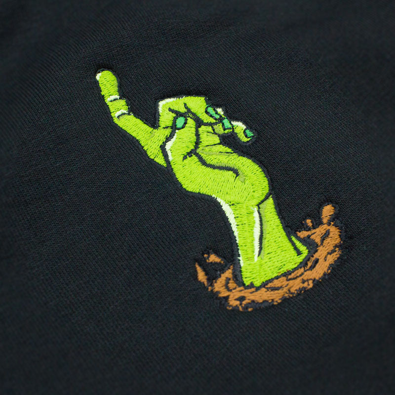 Embroidered zombie hand on a black hoodie, close up